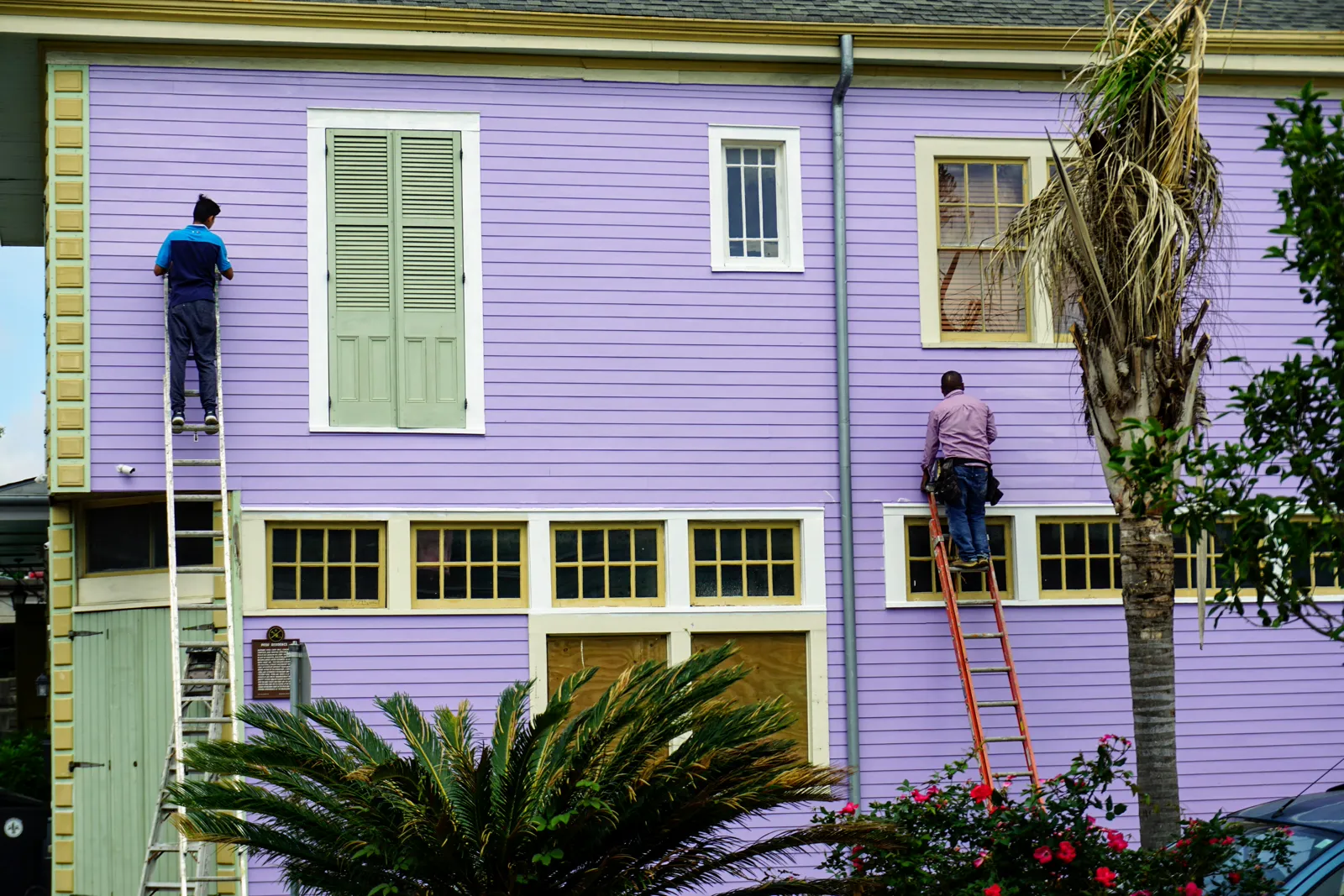 Commercial painters working on a Stockport rental block exterior