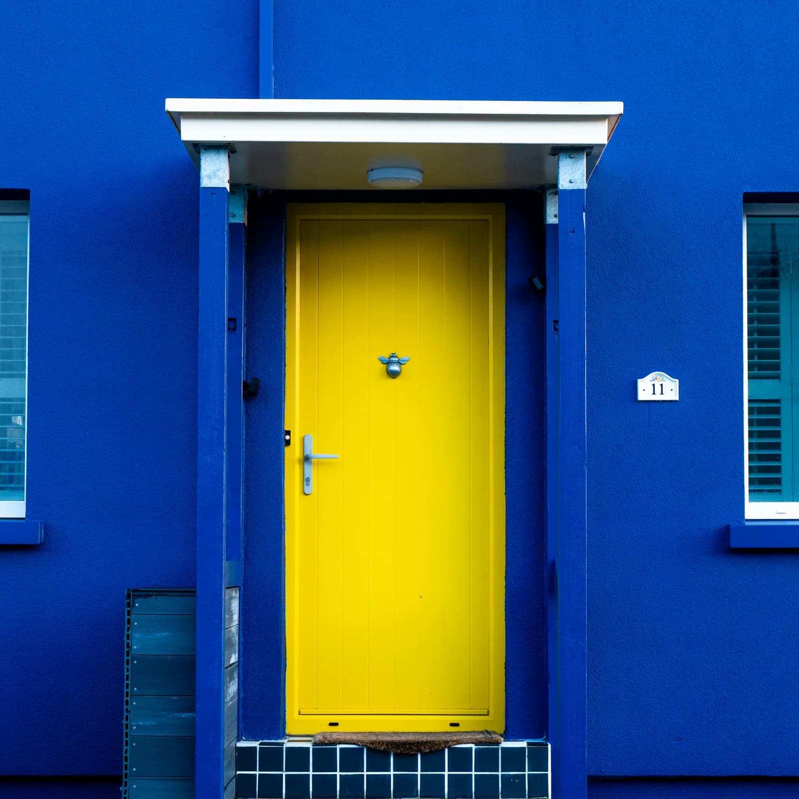 Freshly painted blue house exterior in Cheadle